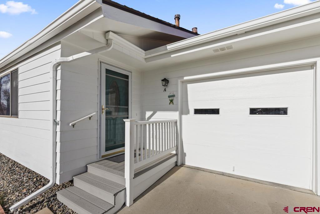 2135 Winston Way, Unit A Montrose, CO 81401 - Photo 27 of 27 a view of a porch with wooden floor and fence