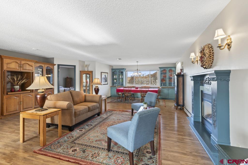 2135 Winston Way, Unit A Montrose, CO 81401 - Photo 4 of 27 a living room with furniture and a fireplace
