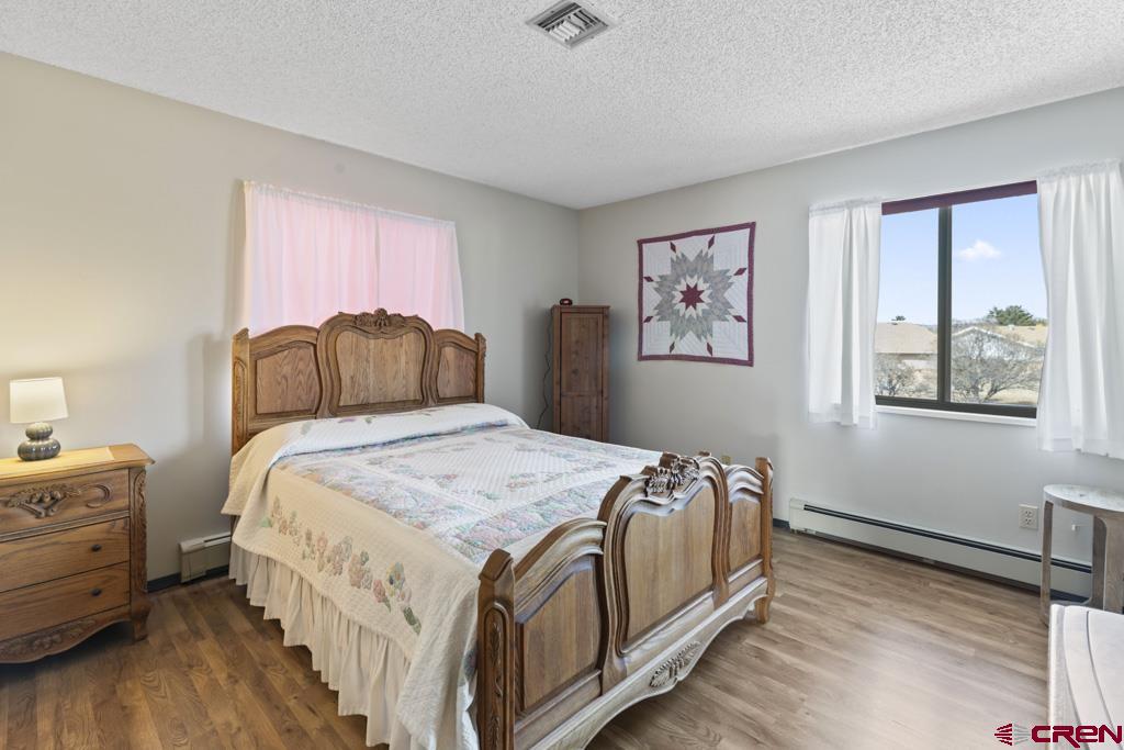 2135 Winston Way, Unit A Montrose, CO 81401 - Photo 8 of 27 a bedroom with a bed and a window