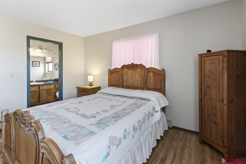 2135 Winston Way, Unit A Montrose, CO 81401 - Photo 9 of 27 a bedroom with a bed and a closet