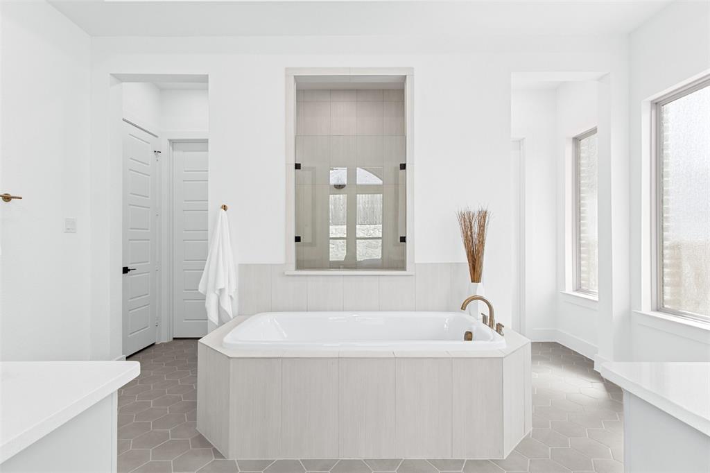 2808 Citation Road Celina, TX 75009 - Photo 17 of 40 a white bath tub sitting in a bathroom