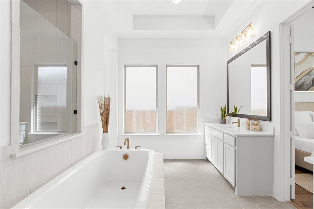 2808 Citation Road Celina, TX 75009 - Photo 21 of 40 a bathroom with a bathtub and a sink