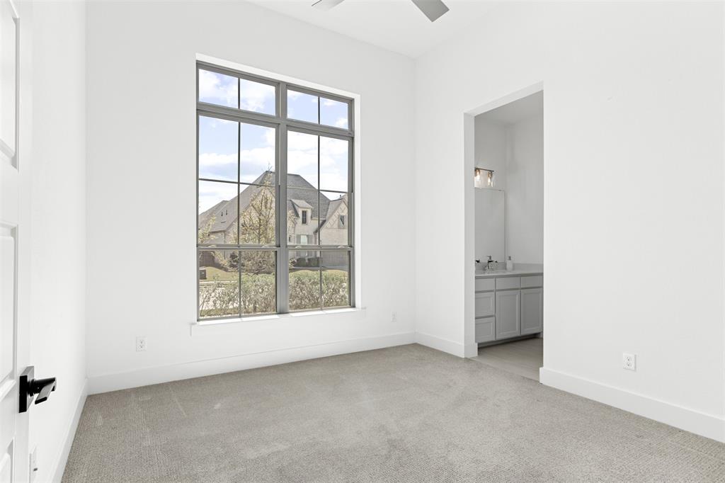 2808 Citation Road Celina, TX 75009 - Photo 22 of 40 an empty room with windows and view of bathroom