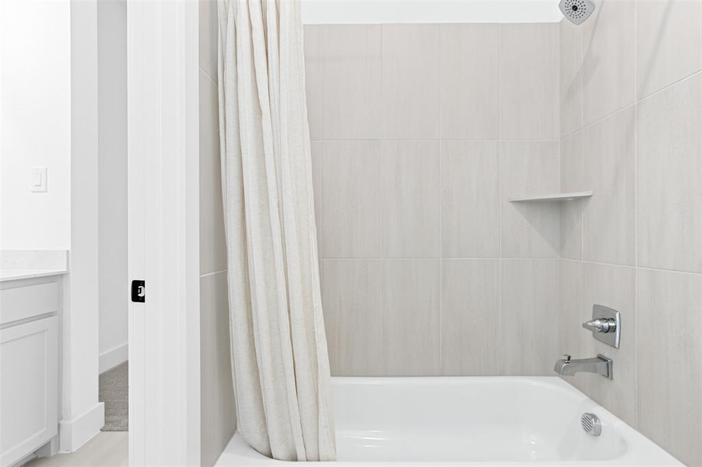 2808 Citation Road Celina, TX 75009 - Photo 25 of 40 a bathroom with a bathtub