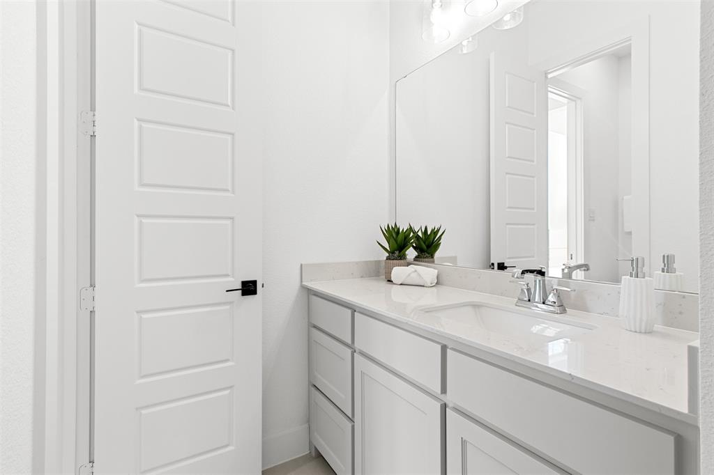 2808 Citation Road Celina, TX 75009 - Photo 26 of 40 a bathroom with a sink and a mirror