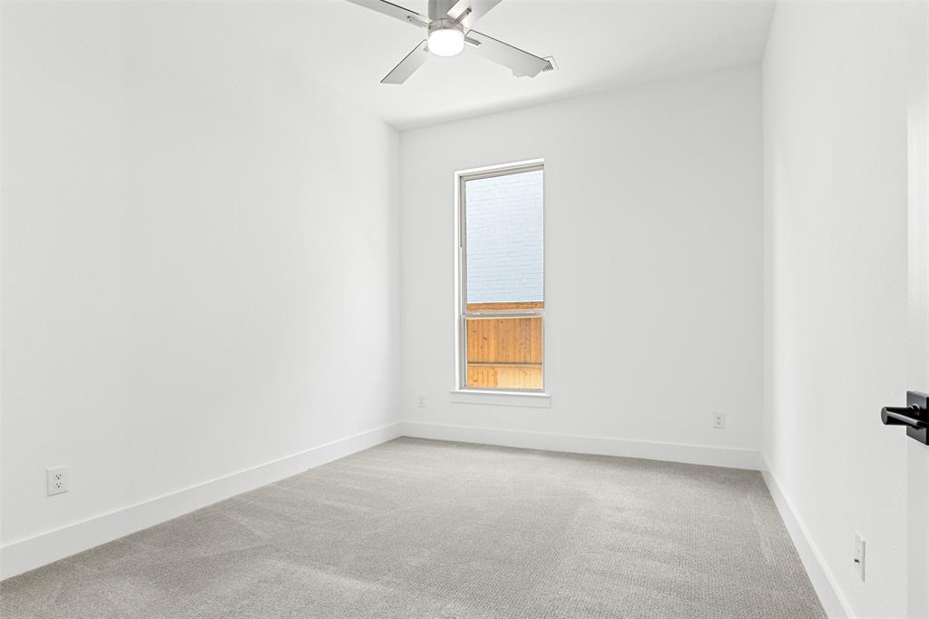 2808 Citation Road Celina, TX 75009 - Photo 27 of 40 an empty room with a window and a ceiling fan