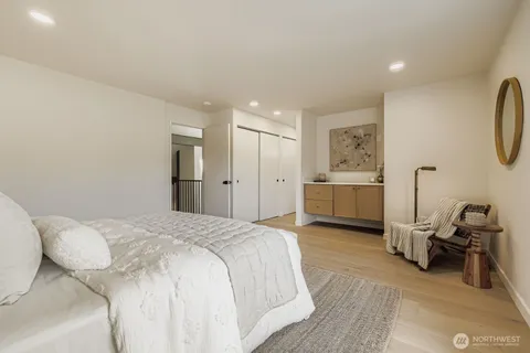 a bedroom with bed and a window