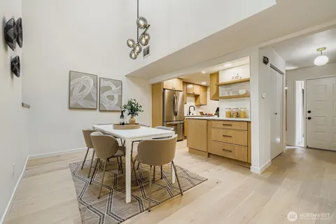 a view of a dining room kitchen and a wooden floor
