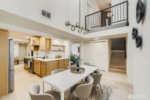 a kitchen with stainless steel appliances a sink stove and cabinets