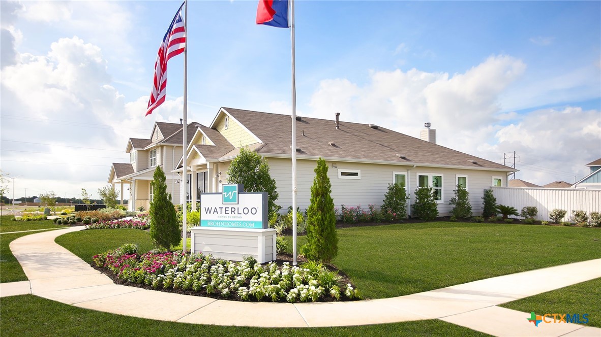 2971 Winding Creek Road Kyle, TX 78640 - Photo 5 of 16 a front view of a house with a yard