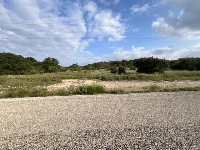 a view of a lake with a yard