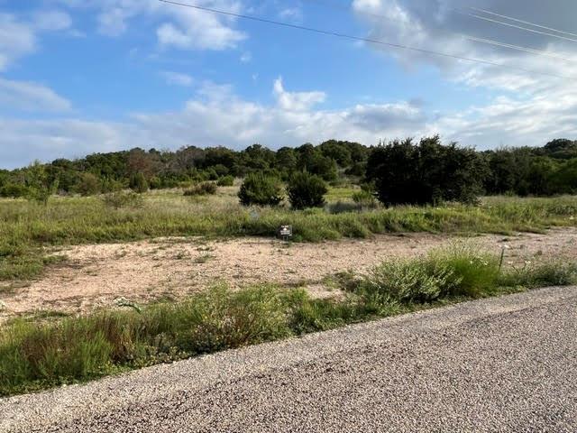 2277 Hidden Vly Road Glen Rose, TX 76043 - Photo 6 of 8 a view of a lake with a yard
