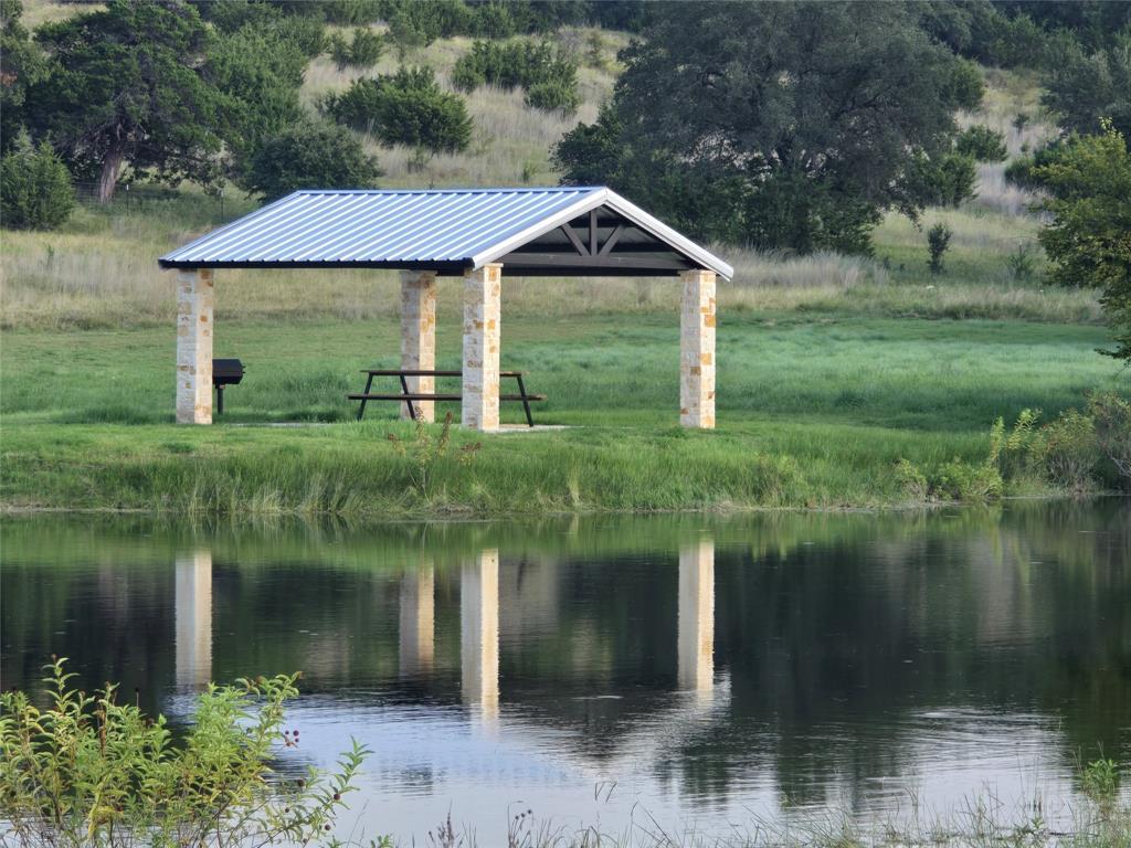 2277 Hidden Vly Road Glen Rose, TX 76043 - Photo 8 of 8 a front view of a house with a yard