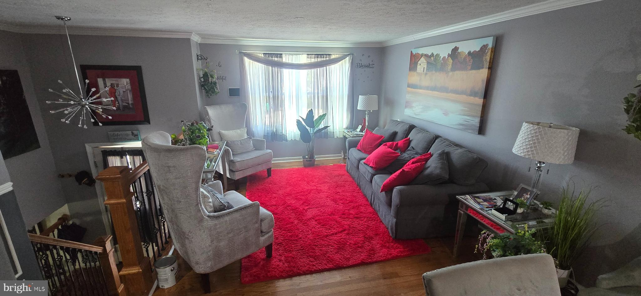 6311 Teaberry Way Clinton, MD 20735 - Photo 3 of 9 a living room with furniture and a potted plant