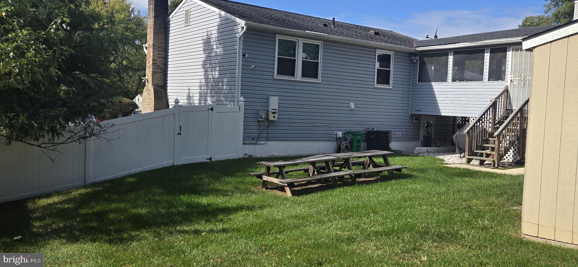 6311 Teaberry Way Clinton, MD 20735 - Photo 5 of 9 a view of a house with a backyard
