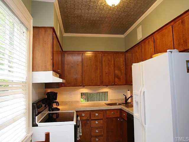 1919 Sunset Drive Raleigh, NC 27608 - Photo 4 of 12 Cozy kitchen has ceramic tile floor and countertops. Other