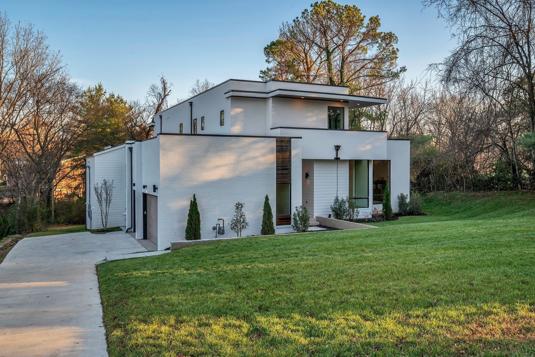 3556 Pleasant Valley Road Nashville, TN 37204 - Photo 2 of 83 a view of a white house with a big yard and large tree