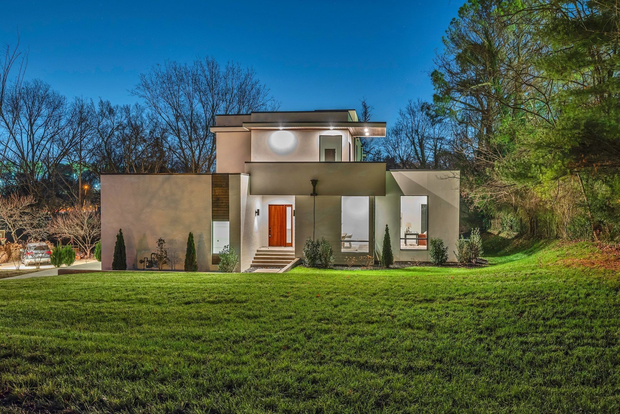 3556 Pleasant Valley Road Nashville, TN 37204 - Photo 7 of 83 a view of a large building with a big yard and large trees