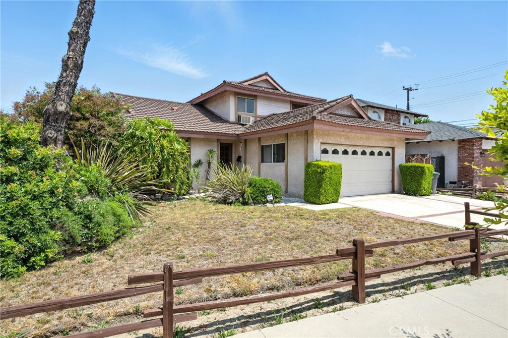 19717 Alonda Drive Carson, CA 90746 - Photo 1 of 31 a front view of a house with garden