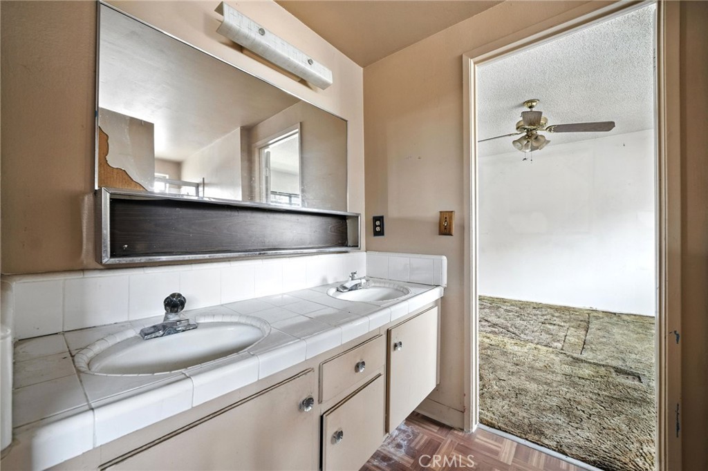 19717 Alonda Drive Carson, CA 90746 - Photo 24 of 31 a bathroom with a sink and a mirror