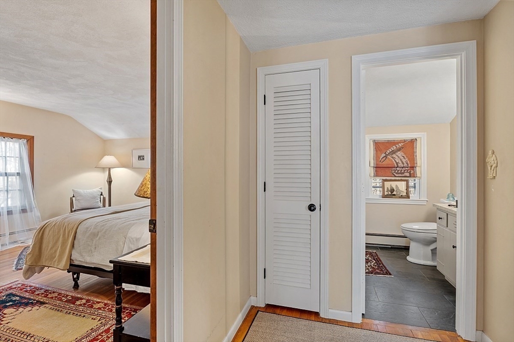 8 Honeysuckle Road Hamilton, MA 01982 - Photo 28 of 41 a bedroom with a bed and a view of bathroom