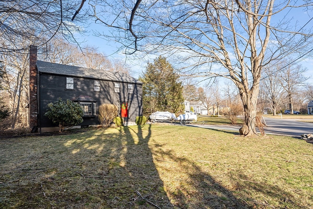 8 Honeysuckle Road Hamilton, MA 01982 - Photo 31 of 41 a view of a yard with a house