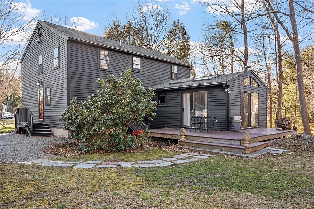 8 Honeysuckle Road Hamilton, MA 01982 - Photo 36 of 41 a wooden bench sitting in front of a house