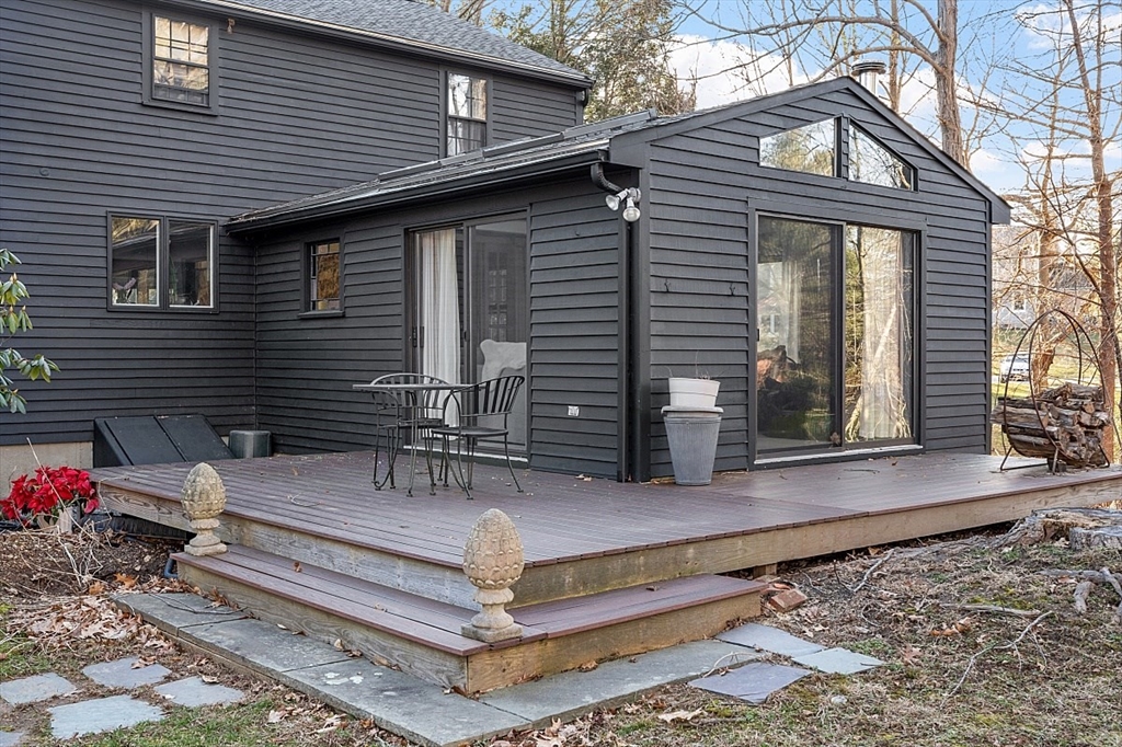 8 Honeysuckle Road Hamilton, MA 01982 - Photo 39 of 41 a view of a house with a chairs in patio
