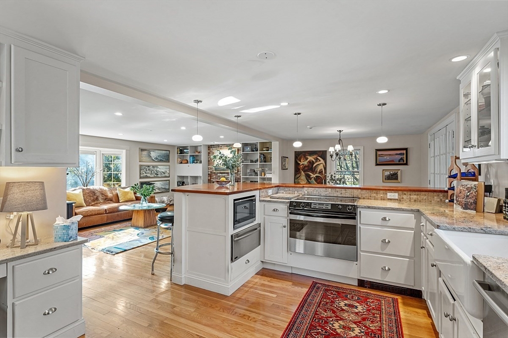 8 Honeysuckle Road Hamilton, MA 01982 - Photo 8 of 41 a kitchen with white cabinets and appliances