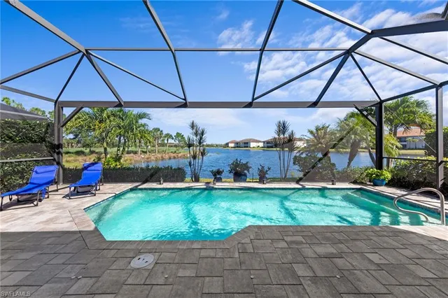 a view of a backyard with plants and patio