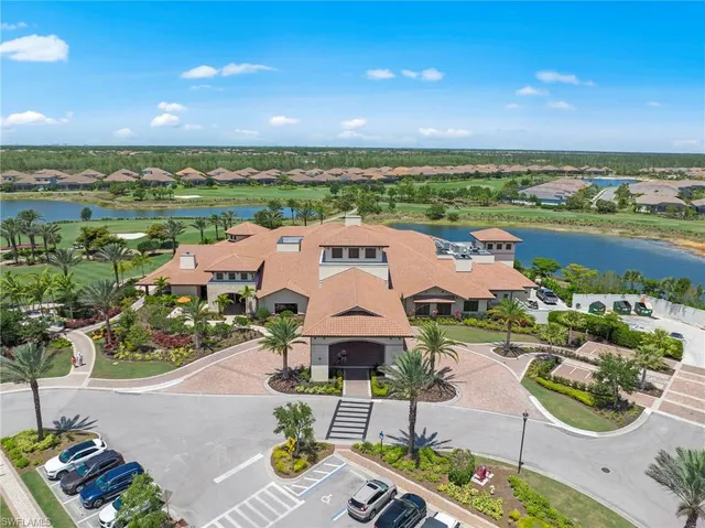 an aerial view of a house with garden space and ocean view