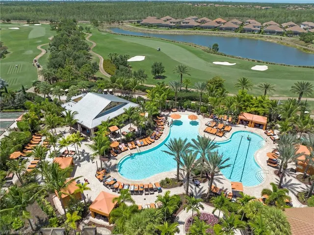 an aerial view of a residential houses with outdoor space and street view
