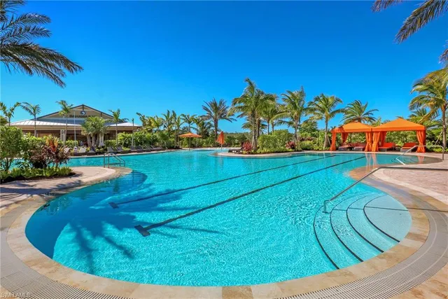 a view of a swimming pool with an outdoor space and seating area