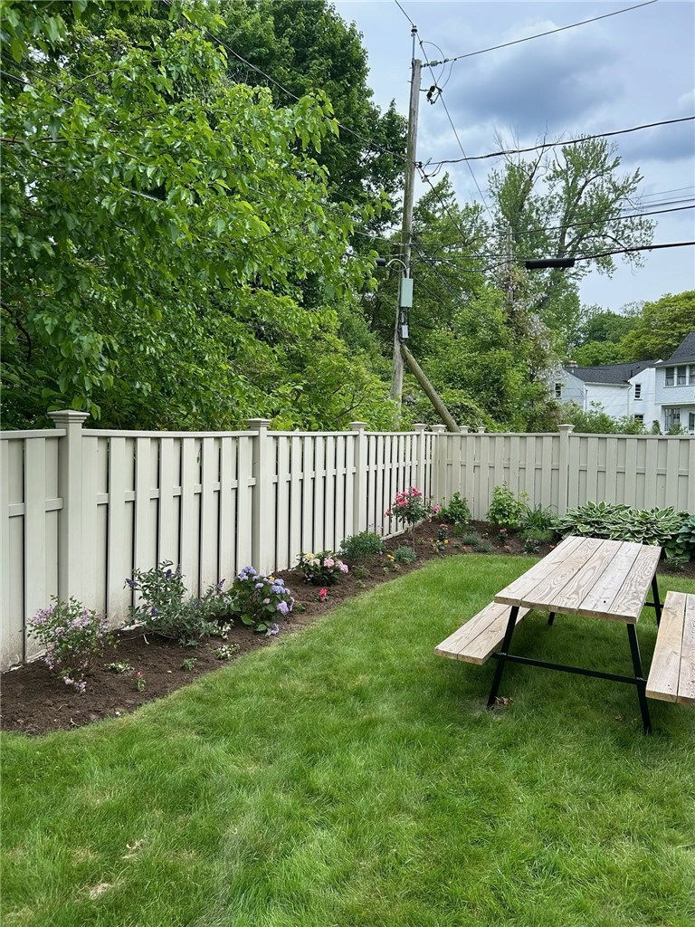 55 Elm Drive Rochester, NY 14609 - Photo 26 of 31 Perennial gardens in the fully fenced yard