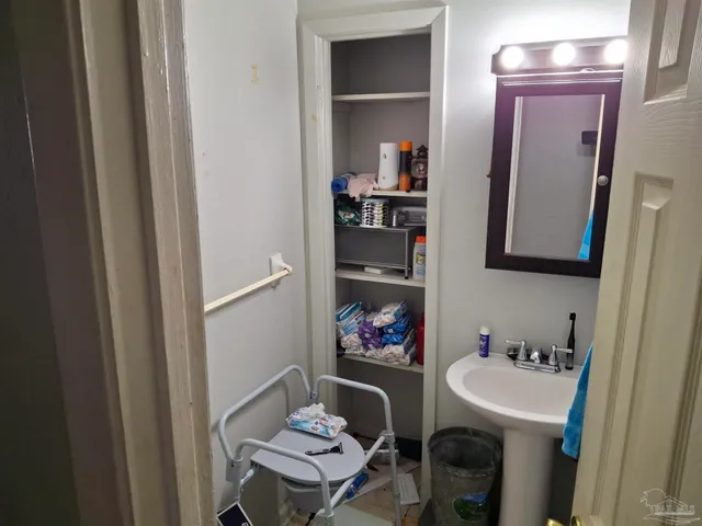 a bathroom with a sink and a mirror