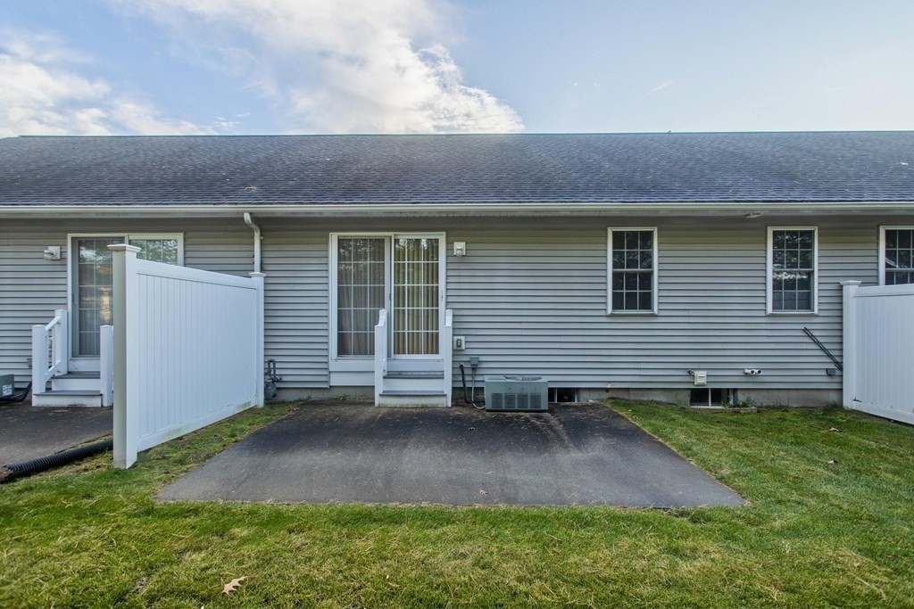 210 Johnson Road, Unit 5 Chicopee, MA 01022 - Photo 17 of 19 a front view of a house with a yard
