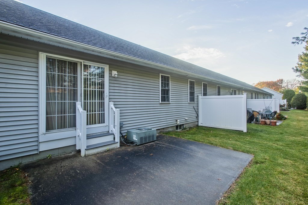 210 Johnson Road, Unit 5 Chicopee, MA 01022 - Photo 19 of 19 a view of a house with a yard and garage