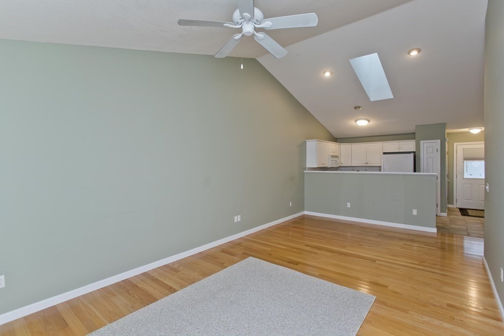 210 Johnson Road, Unit 5 Chicopee, MA 01022 - Photo 10 of 19 a view of a big room with wooden floor and windows