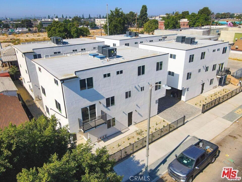 5875 San Pedro Street Los Angeles, CA 90003 - Photo 2 of 17 an aerial view of residential houses with outdoor space and parking