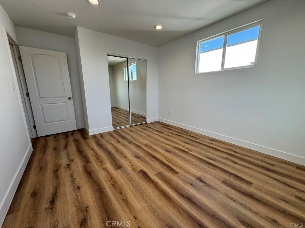 5875 San Pedro Street Los Angeles, CA 90003 - Photo 3 of 17 a view of a room with wooden floor and window