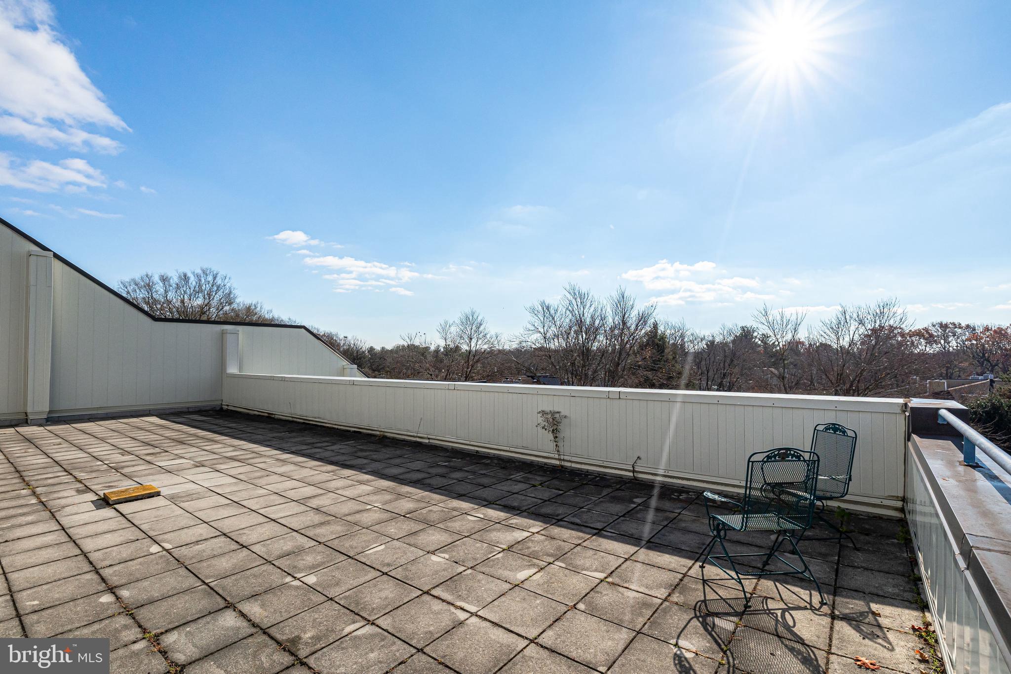 1951 Sagewood Lane, Unit 517 Reston, VA 20191 - Photo 30 of 50 A view of the fifth floor patio - end of hallway.