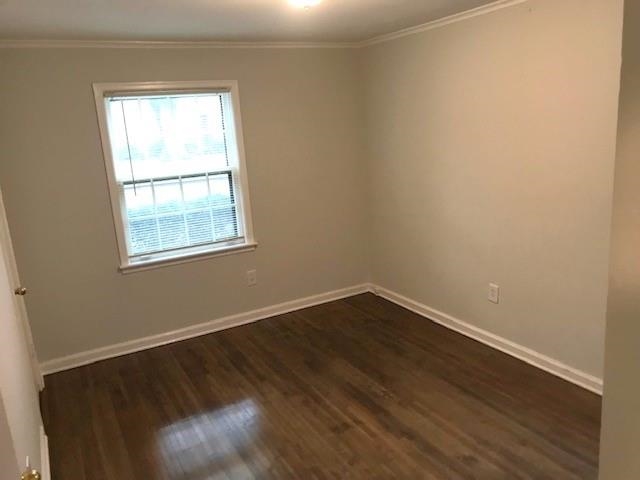 1633 Ivy Road Memphis, TN 38117 - Photo 11 of 14 an empty room with wooden floor and windows