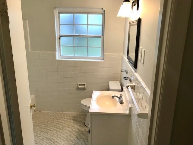 1633 Ivy Road Memphis, TN 38117 - Photo 12 of 14 a bathroom with a sink toilet and a window
