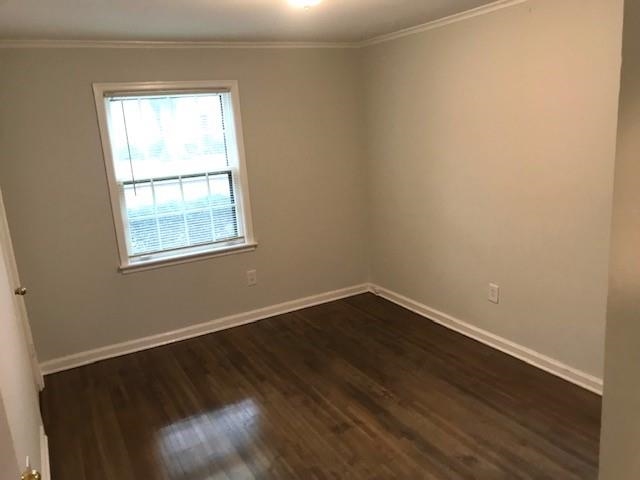 1633 Ivy Road Memphis, TN 38117 - Photo 14 of 14 an empty room with wooden floor and windows