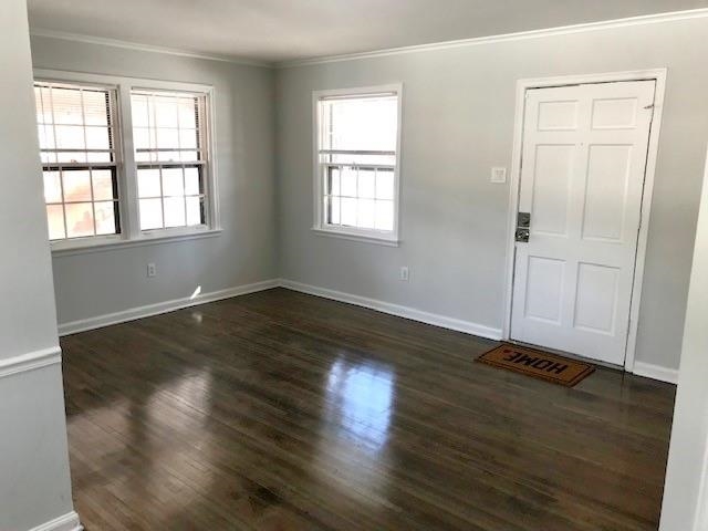 1633 Ivy Road Memphis, TN 38117 - Photo 3 of 14 an empty room with wooden floor and windows