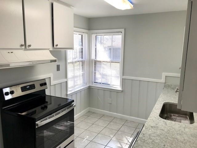1633 Ivy Road Memphis, TN 38117 - Photo 5 of 14 a kitchen with a stove and a window