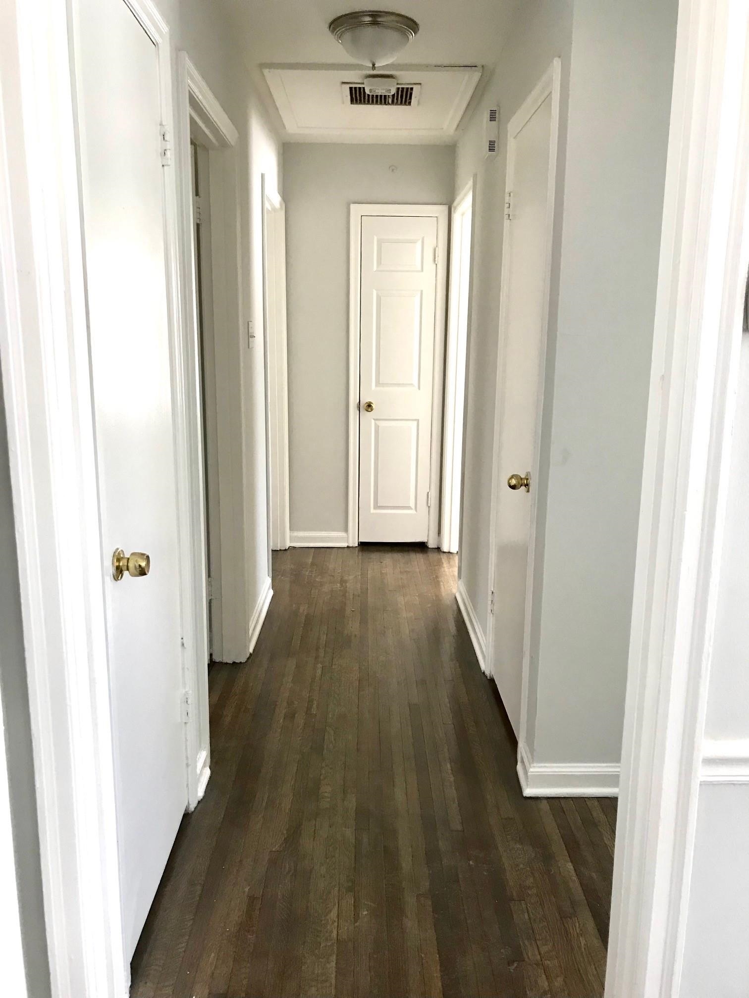 1633 Ivy Road Memphis, TN 38117 - Photo 8 of 14 a view of a hallway with wooden floor