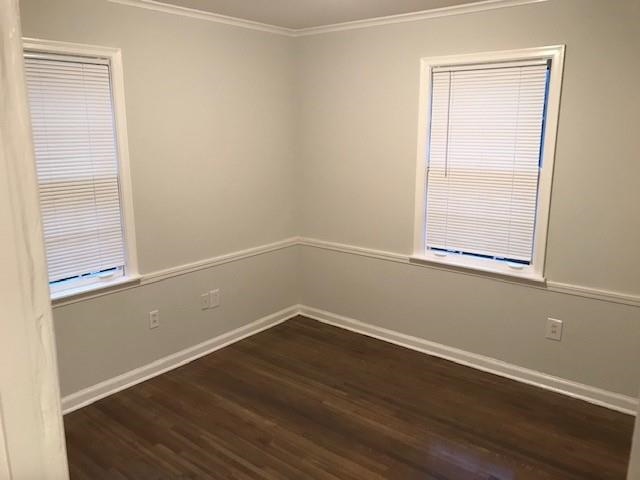 1633 Ivy Road Memphis, TN 38117 - Photo 10 of 14 an empty room with wooden floor and windows