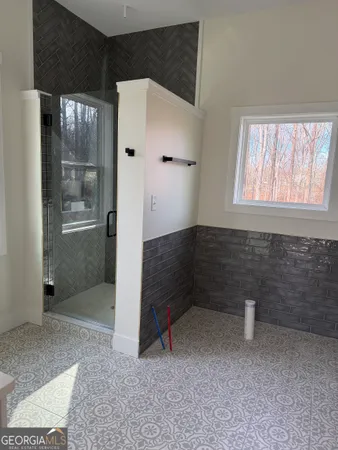 a view of an empty room with a bathroom