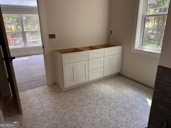 a view of an empty room with a window